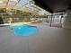 Screened-in pool area with mature landscaping and decorative water feature at 210 S Hale Ave, Tampa, FL 33609