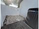 Side yard with brick pavers, gravel, a white vinyl fence, and exterior HVAC unit at 210 S Hale Ave, Tampa, FL 33609