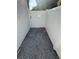 Side yard with gravel and a white privacy fence, providing access to the backyard at 210 S Hale Ave, Tampa, FL 33609