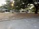 A picturesque street view with mature trees, offering a glimpse of the peaceful neighborhood at 210 S Hale Ave, Tampa, FL 33609