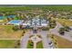 Aerial view of the community clubhouse and pool area, showcasing luxury amenities and landscaped surroundings at 21167 Pleasant Plains Pkwy, Land O Lakes, FL 34637