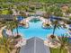 Aerial shot of a community pool with waterslides, seating and well manicured grounds at 21167 Pleasant Plains Pkwy, Land O Lakes, FL 34637