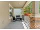 Welcoming front porch with seating area and stone accents at 21167 Pleasant Plains Pkwy, Land O Lakes, FL 34637