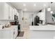 Modern kitchen featuring white cabinetry, quartz countertops, stainless steel appliances, and tile backsplash at 21167 Pleasant Plains Pkwy, Land O Lakes, FL 34637
