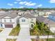 Two-story home with a manicured lawn, two-car garage, and appealing architectural details in a neighborhood setting at 2132 Shining Azul Way, Lutz, FL 33558
