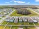Stunning aerial view showcasing a well-planned neighborhood with lush greenery and community amenities at 2132 Shining Azul Way, Lutz, FL 33558