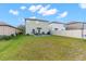 Large backyard with well-maintained lawn, creating a perfect outdoor space for activities and relaxation at 2132 Shining Azul Way, Lutz, FL 33558