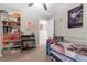 Bright bedroom with playful decorations, a desk, and a cozy bed at 2132 Shining Azul Way, Lutz, FL 33558