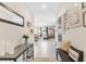 Inviting home entryway featuring modern decor, neutral color palette, tile flooring, and an open view to the living area at 2132 Shining Azul Way, Lutz, FL 33558