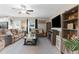 Inviting living room with ceiling fan, neutral tones, comfortable seating, stylish decor, and plenty of natural light at 2132 Shining Azul Way, Lutz, FL 33558