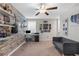 Bright office space featuring a decorative brick wall, shelving, desk, and comfortable seating at 2132 Shining Azul Way, Lutz, FL 33558