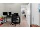 Functional office space with dual monitors, a comfortable chair, and ample lighting at 2132 Shining Azul Way, Lutz, FL 33558