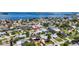 An aerial view shows the property's proximity to local services, the ocean, and neighborhood amenities at 2175 Edythe Dr, Dunedin, FL 34698
