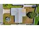 An aerial view of a charming home with a well-maintained yard and driveway at 2175 Edythe Dr, Dunedin, FL 34698