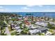 An aerial view shows the property's proximity to the ocean and neighborhood amenities at 2175 Edythe Dr, Dunedin, FL 34698