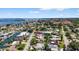 This aerial view shows the property's proximity to the ocean, the neighborhood and community amenities at 2175 Edythe Dr, Dunedin, FL 34698