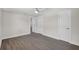 Bedroom with neutral paint, ceiling fan, and three doors offering lots of space at 2175 Edythe Dr, Dunedin, FL 34698