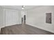 Bedroom featuring hardwood floors, closet, and neutral-toned walls at 2175 Edythe Dr, Dunedin, FL 34698