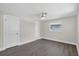 Bedroom with ceiling fan and closet space with great natural light at 2175 Edythe Dr, Dunedin, FL 34698