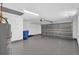 Clean and spacious garage features an epoxy floor, offering functionality and style at 2175 Edythe Dr, Dunedin, FL 34698