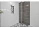 Sleek shower with vertical tile and convenient recessed niche at 2175 Edythe Dr, Dunedin, FL 34698