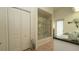 Bright bathroom with a glass-enclosed tub and shower combination and neutral tile floors at 3102 Lema Dr, Spring Hill, FL 34609