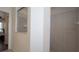 Attached bathroom with an accessible shower and doorway to the bedroom at 3102 Lema Dr, Spring Hill, FL 34609
