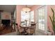 Charming dining area with a glass table and seating, adjacent to a view of the pool at 3102 Lema Dr, Spring Hill, FL 34609