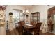 Elegant dining room with wooden table, stylish chandelier, and decorative accents at 3102 Lema Dr, Spring Hill, FL 34609
