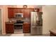 Modern kitchen with stainless steel appliances, sleek cabinets, and efficient layout at 3102 Lema Dr, Spring Hill, FL 34609