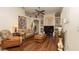 Inviting living room with a comfortable sofa, ceiling fan, and stylish decor at 3102 Lema Dr, Spring Hill, FL 34609