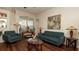 Comfortable living room featuring hardwood floors, bright natural light, and stylish furniture at 3102 Lema Dr, Spring Hill, FL 34609