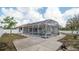 Backyard features an in-ground screened pool with a white vinyl fence at 3102 Lema Dr, Spring Hill, FL 34609