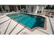 Beautiful backyard pool featuring a screened enclosure and a spacious patio area at 3102 Lema Dr, Spring Hill, FL 34609