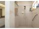 Accessible tile shower with a glass enclosure and showerhead at 3102 Lema Dr, Spring Hill, FL 34609