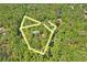 Aerial view of a secluded house surrounded by lush greenery and a beautiful winding creek with lot lines at 3431 Riderwood Dr, Dade City, FL 33523