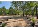 Inviting backyard deck with potted plants, ideal for outdoor living amidst a serene setting at 3431 Riderwood Dr, Dade City, FL 33523