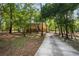 Long driveway leading up to the charming two-story home surrounded by lush greenery at 3431 Riderwood Dr, Dade City, FL 33523