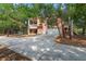 Charming two-story home with a screened porch, attached garage, and a long driveway at 3431 Riderwood Dr, Dade City, FL 33523