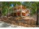 Charming two-story home with a screened porch, attached garage, and a long driveway at 3431 Riderwood Dr, Dade City, FL 33523