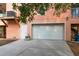 Attached two-car garage with a white door and exterior access at 3431 Riderwood Dr, Dade City, FL 33523