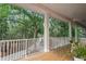 Covered porch overlooking a treelined walkway at 3431 Riderwood Dr, Dade City, FL 33523