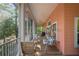 Outdoor covered porch area with swing and seating at 3431 Riderwood Dr, Dade City, FL 33523