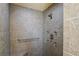 Tiled walk-in shower with built-in seat and chrome fixtures at 3431 Riderwood Dr, Dade City, FL 33523