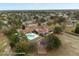 Aerial view of community clubhouse with a pool, playground, trees and surrounding neighborhood at 3464 Misty View Dr, Spring Hill, FL 34609