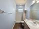 Bathroom featuring tiled shower and a sink with ample counter space at 3464 Misty View Dr, Spring Hill, FL 34609