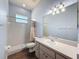 Bathroom featuring a single sink vanity, and tile shower at 3464 Misty View Dr, Spring Hill, FL 34609