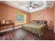 Spacious bedroom with wood floors, tray ceiling and natural light at 3464 Misty View Dr, Spring Hill, FL 34609