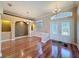 Elegant dining room featuring hardwood floors, decorative lighting, and an inviting ambiance at 3464 Misty View Dr, Spring Hill, FL 34609