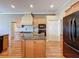 Spacious kitchen with wooden cabinets, granite countertops, and modern appliances at 3464 Misty View Dr, Spring Hill, FL 34609